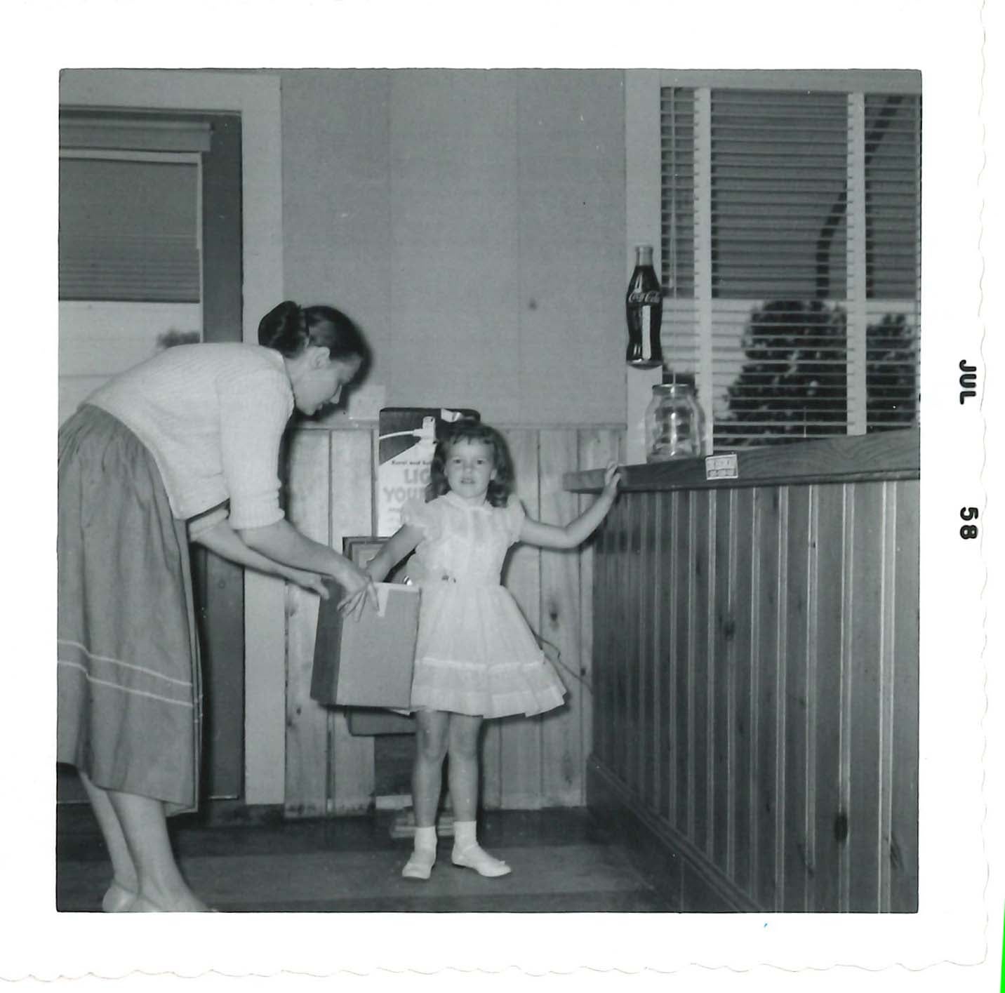 black and white image of lady with young girl